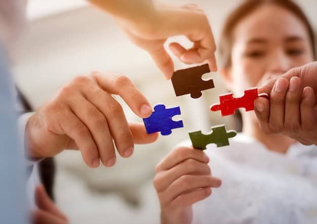 Group of business people assembling jigsaw puzzle and represent team support and help together. Premium Photo